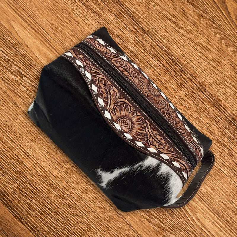 Jet Black Western Luxe Leather Toiletry Bag featuring beautiful hand-tooled designs and a secure zipper, perfect for everyday use.