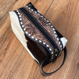 Midnight Cowhide Western Luxe Leather Toiletry Bag showcasing hand-tooled craftsmanship and a durable zipper, ideal for chic storage.