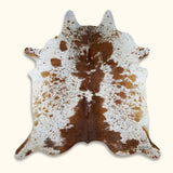 Full view of Texas Range brown cowhide rug - natural speckled hide.