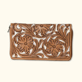 Back view of a Western-style hair-on cowhide zip clutch featuring detailed floral designs.