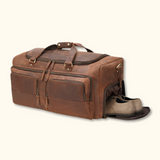 A brown, full-grain leather duffel bag with a ventilated shoe compartment