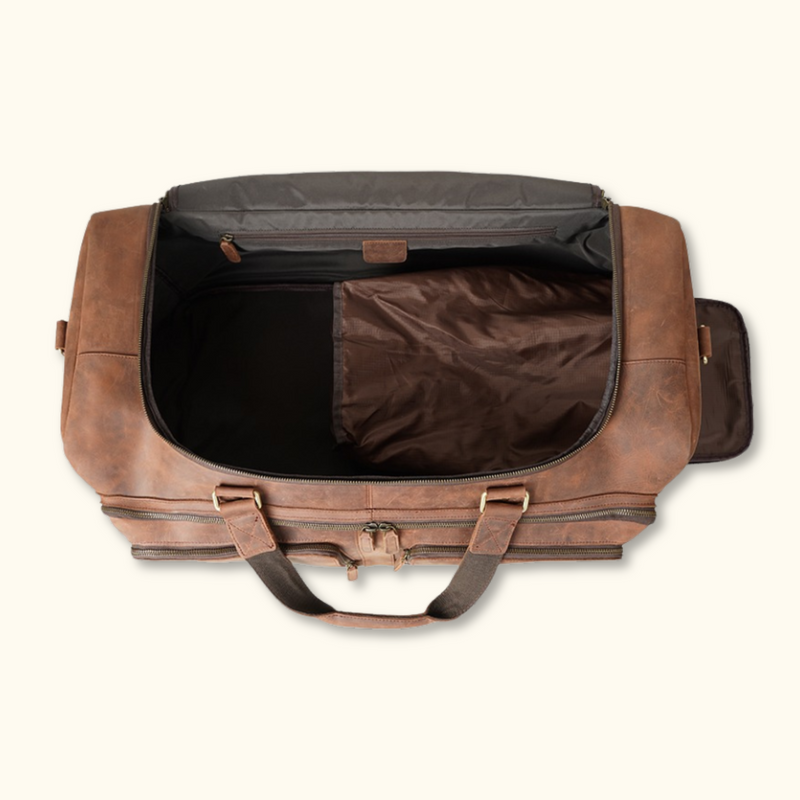 The Homesteader - Luxurious brown leather weekender duffel bag with ventilated shoe compartment. Perfect for travel.