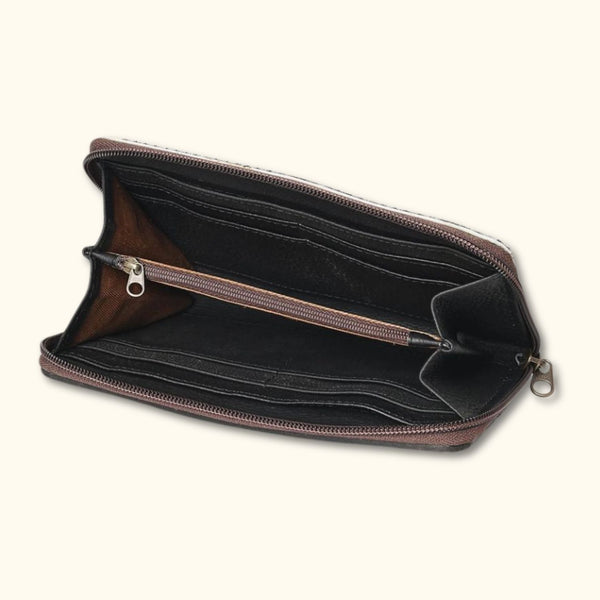  Interior view of the Canyon Blossom Leather Wallet, featuring spacious compartments and a secure zipper pocket.