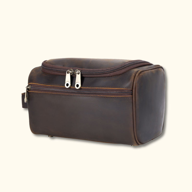 Side view of the High Plains Leather Toiletry Bag showcasing its durable full-grain leather and side zipper compartment.