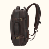 The Stetson Peak - Expandable Men's Leather Backpack in dark brown, side view highlighting the adjustable straps, sturdy buckles, and spacious compartments.
