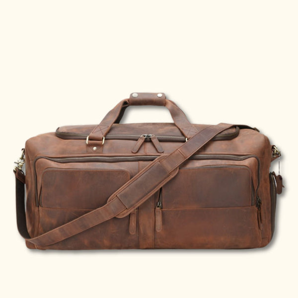 Western Luxury Leather Duffel Bag with a shoulder strap, featuring multiple zippered compartments, sturdy handles, and premium leather construction, designed for durability and style.