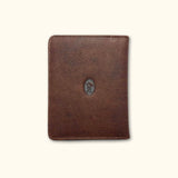 Front view of The Western Traveler Leather Passport Holder in brown, made from premium Italian leather and featuring the signature Western logo.